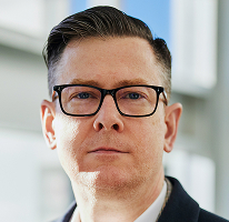 Портрет на CEO Alexander Hughes на компания за крипто търговия